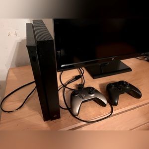 Microsoft XBox One with two controllers and cables